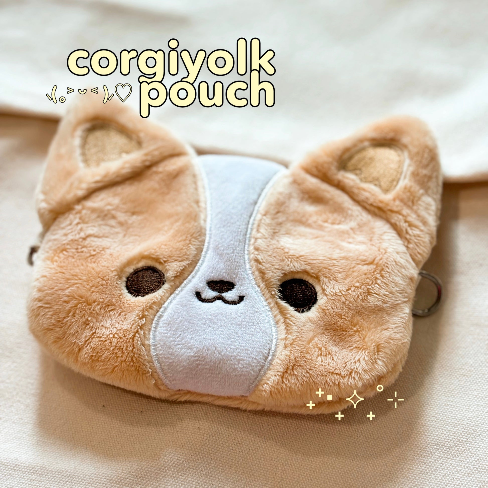 corgiyolk pouch to keep your essentials! comes with a card slot for easy access and features a uniquely designed corgi lining inside of the pouch